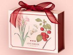 a small gift box with a red ribbon on it that says love forever and flowers