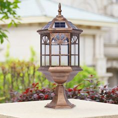 a small lantern sitting on top of a cement block