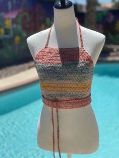 Handmade Crochet Halter top- Desert landscape inspired colors- 100% cotton. Wash Gentle - Dry flat for best care. Top should fit most. Longer tie allows for expansion. Can be tied in front or back. Mannequin is 34 inch bust and 26 inch waist. Multicolor Sleeveless Cotton Crop Top, Multicolor Cropped Cotton Crop Top, Casual Fitted Multicolor Halter Top, Multicolor Cotton Cropped Crop Top, Multicolor Cotton Crop Top, Fitted Cotton Top For The Beach, Summer Red Cotton Halter Top, Casual Multicolor Cropped Halter Top, Red Cotton Halter Top For Summer