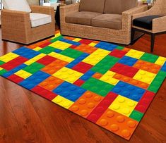 a living room filled with lots of furniture and colorful rugs on top of a hard wood floor