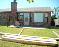 a house with some wooden boards in front of it