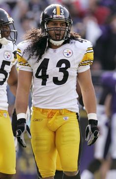 two football players standing next to each other