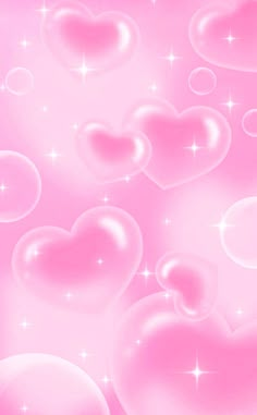 pink hearts floating in the air with sparkles and stars on it's sides