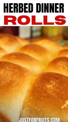 a close up of rolls with the words herbed dinner rolls