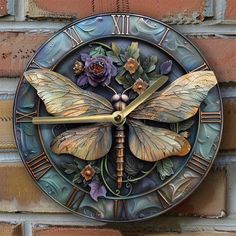 a dragonfly clock on the side of a brick wall