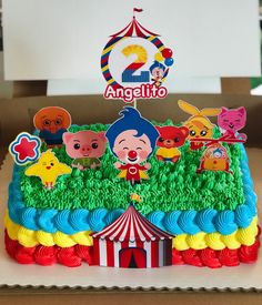 there is a birthday cake decorated with cartoon characters