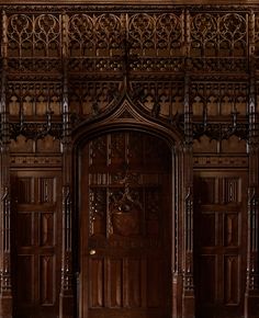 an ornate wooden door with intricate carvings on it