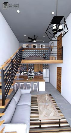 a living room filled with furniture next to a stair case and ceiling fan in an open floor plan