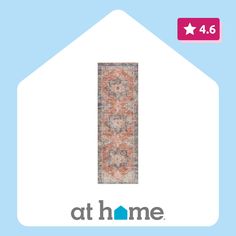 a blue and orange rug with the words at home on it's front corner