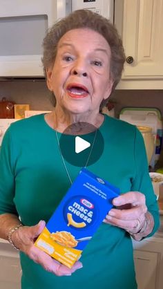 an older woman holding a box of cereal