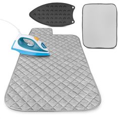 an ironing board and pad are shown in this image, with the iron on it's side