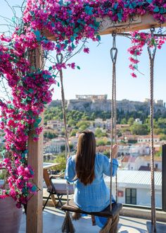 a woman sitting on a swing with the text 17 best photo spots in athens + map