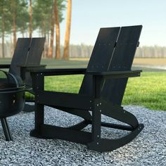 two adironda chairs sitting next to each other on gravel near a bbq