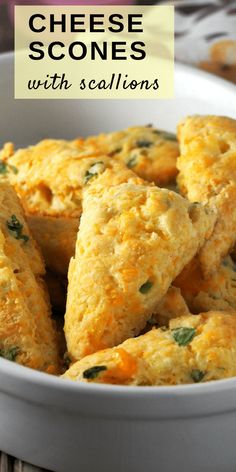 cheesy scones in a white bowl on a table with text overlay