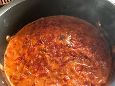 a large pot filled with food sitting on top of a stove