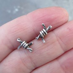 "Small Barbed Wire Stud Earrings Sterling Silver Men Women Grunge Punk Goth Unisex Stud Earrings : Little barbed wire bits handmade out of sterling silver. 100% handmade by me. They measure about 1/2\". Great for a special guy or gal! 100% handmade by me in my little home studio. Enter my shop: https://www.etsy.com/shop/artdi Join me on Facebook: https://www.facebook.com/Artdi-Diana-Anton-Jewelry-Design-44805607932/ Find me on Instagram: https://www.instagram.com/dianaantonjewelrydesign/" Male Earrings Men, Men’s Earrings, Mens Earings, Wire Stud Earrings, Women Grunge, Men's Piercings, Grunge Earrings, Mens Earrings, Men's Earrings