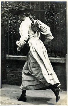 an old black and white photo of a woman dancing