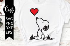 a white shirt with a snoopy dog holding a red heart