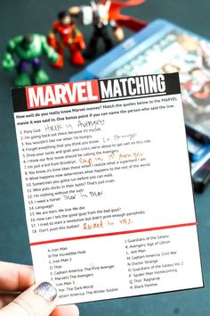 a person holding up a card with the words'marvel matching'written on it