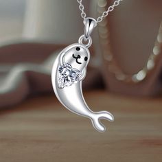 This adorable seal pendant is a symbol of gentleness and wisdom, making it a thoughtful gift for ocean and seal enthusiasts. Crafted from 925 sterling silver, this hypoallergenic, tarnish-resistant necklace is nickel-free, lead-free, and cadmium-free, ensuring safe and long-term wear. The pendant measures 1.08 x 0.8 inches and comes in an elegant gift box, complete with a polishing cloth. Perfect for special occasions like birthdays, Mother's Day, Christmas, or as a treat for ocean lovers. Ocean Lover, Jewelry For Her, Heart Jewelry, Elegant Gift, Favorite Jewelry, Charm Necklace, Thoughtful Gifts, Necklace Lengths, Charms