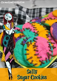 colorful sugar cookies with sprinkles are on a plate