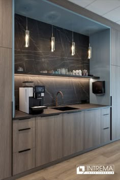 a modern kitchen with marble counter tops and wooden cabinetry, along with stainless steel appliances