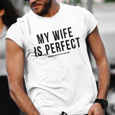 Introducing the ultimate expression of love and appreciation for your perfect wife - the "My Wife Is Perfect She Even Bought Me This Nice Shirt." This unisex t-shirt from Kooskadoo is not just a piece of clothing, but a heartfelt proclamation for all to see. Made with love and respect, this t-shirt is the perfect gift for any occasion, be it holidays, birthdays, anniversaries, or just because. Crafted with care, our Bella-Canvas t-shirt provides unrivaled comfort and style. Made from premium qua I Love My Wife Tee Shirt, Perfect Wife, My Wife Is, Love And Respect, Personalized T Shirts, My Wife, Be Perfect, Piece Of Clothing, Cool Shirts