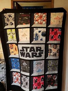 a star wars quilt hanging on the wall