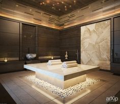 a large bathroom with stone flooring and lights on the ceiling, along with two sinks