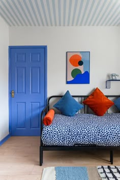 a living room filled with furniture and blue doors