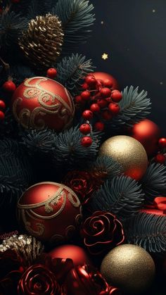 red and gold christmas ornaments on a tree with pine cones in the foreground, against a black background