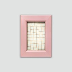 a pink frame with a checkered pattern on the front and bottom, hanging from a wall