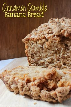 a loaf of cinnamon crumble banana bread on a cutting board with the rest of it cut in half