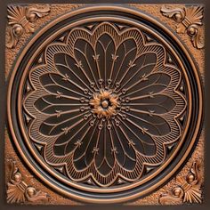 an intricately designed metal plate with flowers on it