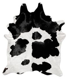 a black and white cowhide rug on a white background