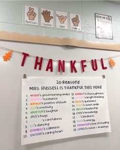 a sign that says thank you all for thanksgiving and is hanging on the wall in front of a bulletin board