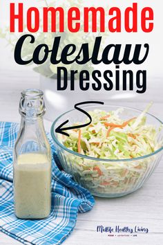 homemade coleslaw dressing in a glass bowl next to a bottle with dressing on it