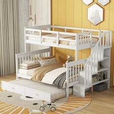 a white bunk bed sitting on top of a wooden floor