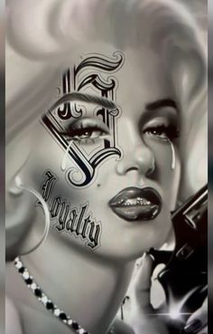 a woman's face painted in black and white with the words marilyn monroe on it