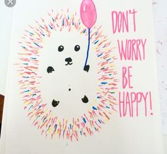 a card with a drawing of a hedgehog holding a balloon saying don't worry be happy