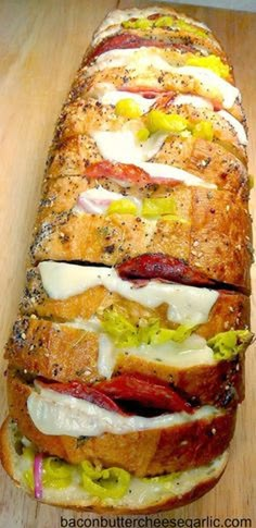 a long sandwich with meat, cheese and lettuce