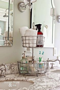 a bathroom sink with two baskets on it