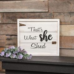 a sign that says, that's what she shed on top of a shelf