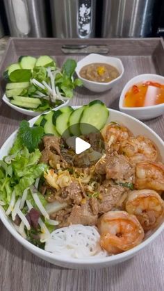 a white bowl filled with meat and veggies