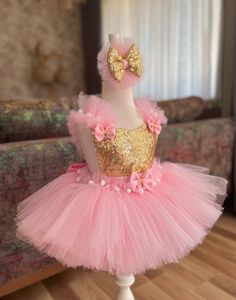 Introducing our Exquisite Pink & Gold Tutu Dress for Kids and Babies - A Magical Fairy Dress Delight! Prepare for enchantment with our meticulously crafted Pink & Gold Tutu Dress. Perfect for 1st-year birthdays, Halloween, festivals, special occasions, adorable toddler girl costumes, and as a stunning first birthday dress, this creation is a true showstopper. 👑 Unmatched Comfort: Soft Tutu on the outside, cotton lining on the inside. No itching or irritation, just pure comfort for your little fairy. 🌟 Tailored Perfection: Fully customizable for a perfect fit. Adjustable straps and elastic waist ensure your baby girl feels comfortable and looks amazing. 💖 Superior Craftsmanship: Sewn with love, this fairy dress stands out from the crowd. ✨ Unveiling the Extraordinary: 1️⃣ Premium Quality Christmas Princess Dress In Pink, Pink Tulle Tutu Dress For Christmas, Pink Princess Dress For Christmas Party, Pink Fairytale Fairy Dress For Party, Festive Gold Tulle Dress, Whimsical Tutu Dress For Easter Dress-up, Cute Pink Tutu Dress For Christmas, Pink Tutu Dress For Carnival Party, Gold Princess Tutu Dress With Ruffles