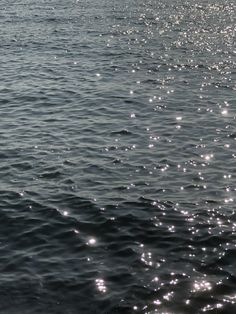 the sun shines brightly on the water as it reflects off the surface of the ocean