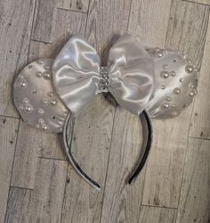 "Hello! Welcome to my shop! All ears are handmade by me. Please follow me on I G @adashoftink for the latest styles and custom designs. Congratulations to the beautiful bride! These ears will help make her special time even more memorable! Perfect for a bridal shower gift, anniversary trip or engagement photos! The ears and bow are handmade and sewn on to a 1 inch headband. This style fits perfectly and comfortable to wear in the parks all day! You will get compliments all day with this sparkly White Satin Fabric, Headband Bridal, Anniversary Trips, Bridal Shower Gift, Please Follow Me, Bridal Headband, Bride To Be, Mouse Ears, Bridal Shower Gifts