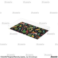 a tray with colorful tropical leaves on it