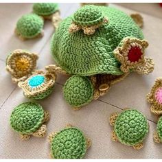 crocheted turtle and other items are laying on the floor