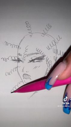 a person holding a pink and blue pen in front of a drawing of a woman's face